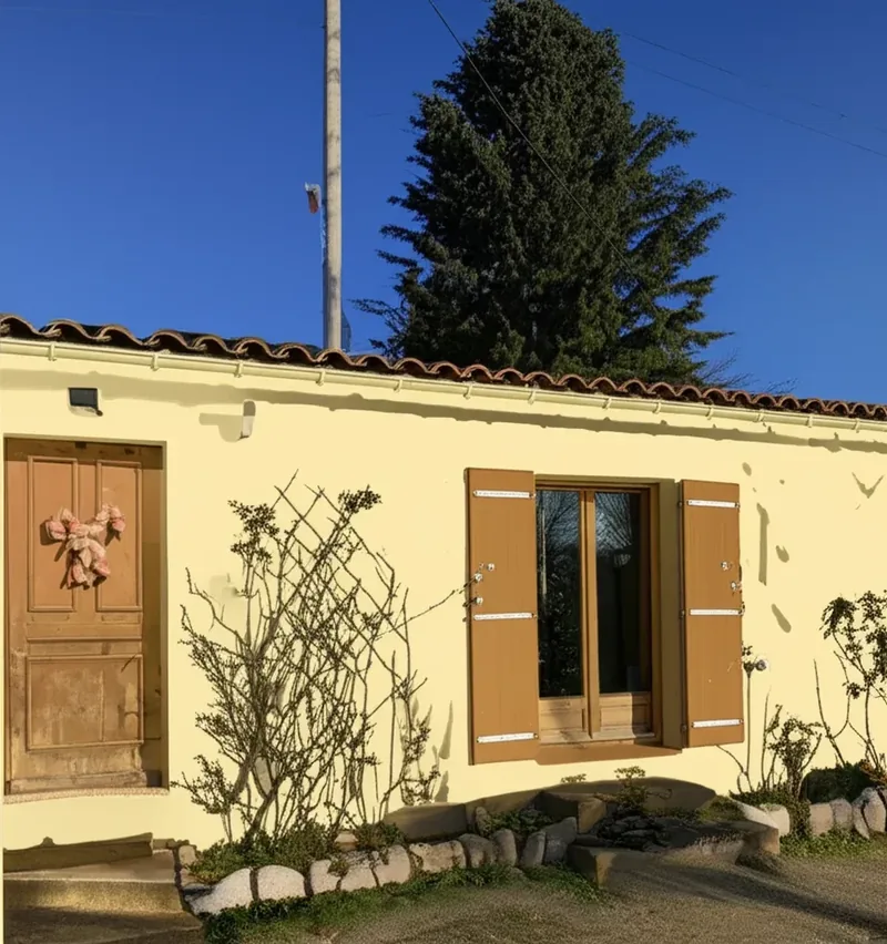 Exterior house color palette example showing 60-30-10 rule with greige body, white trim, navy door
