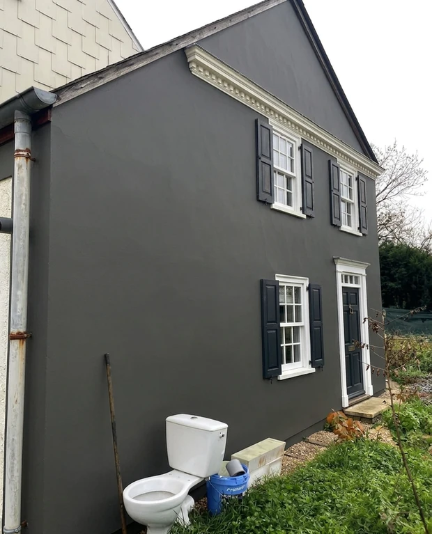 House facade in Iron Ore (Sherwin-Williams SW 7069) after AI colour preview