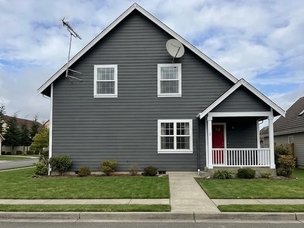 Dark gray house with brick red front door, AI color preview