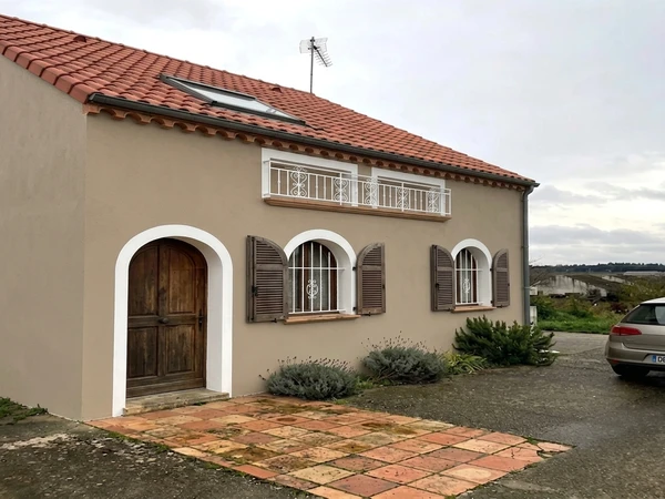 Spanish Colonial exterior in warm clay-beige with terracotta tile roof, AI color preview